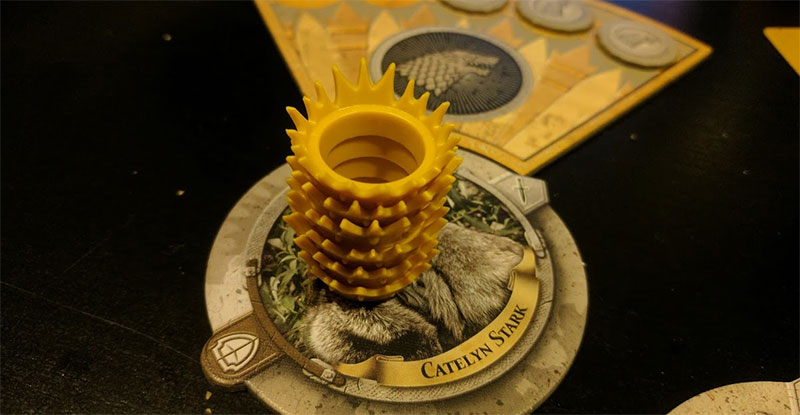 While most of the game is played using cards and tokens, the plastic crowns used for health/power are great.